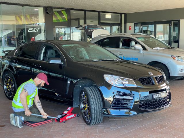 last-check-inspector-jacking-up-a-holden-hsv-to-inpect